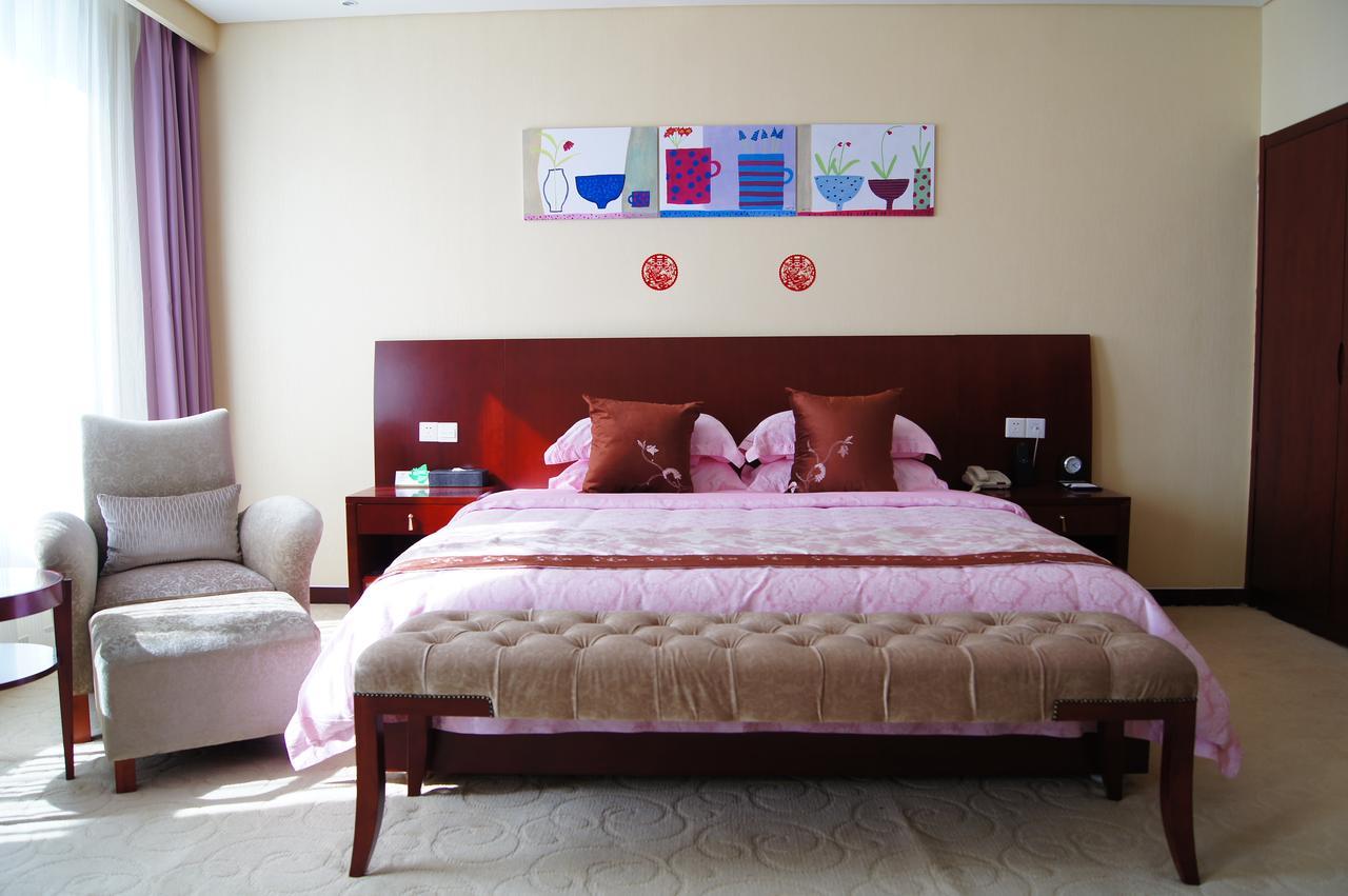 Fuxing Oriental Boutique Hotel Chifeng Room photo