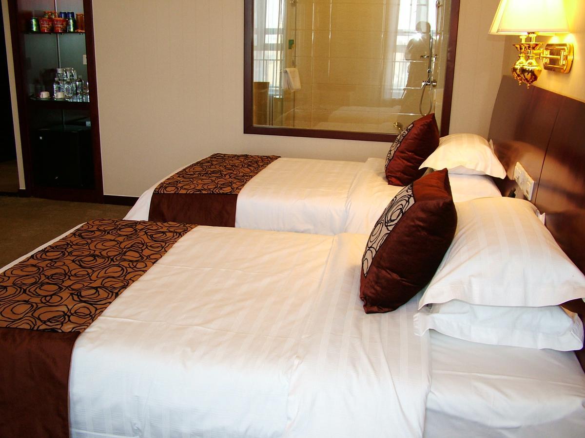 Fuxing Oriental Boutique Hotel Chifeng Room photo