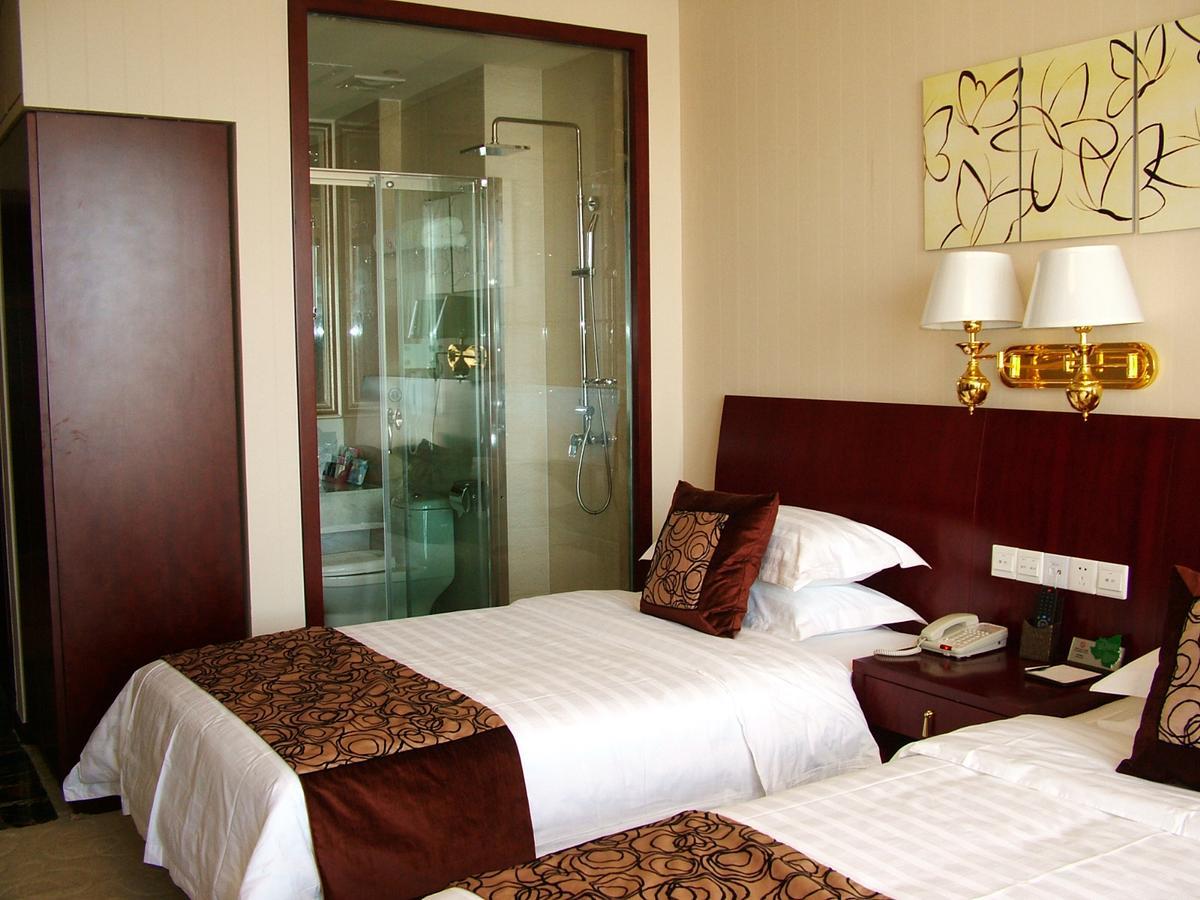 Fuxing Oriental Boutique Hotel Chifeng Room photo