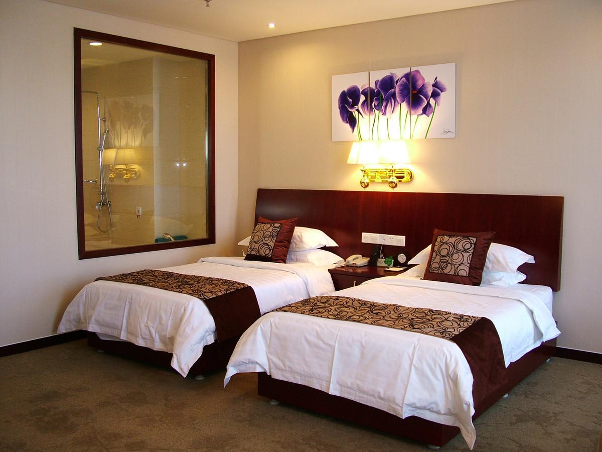 Fuxing Oriental Boutique Hotel Chifeng Room photo